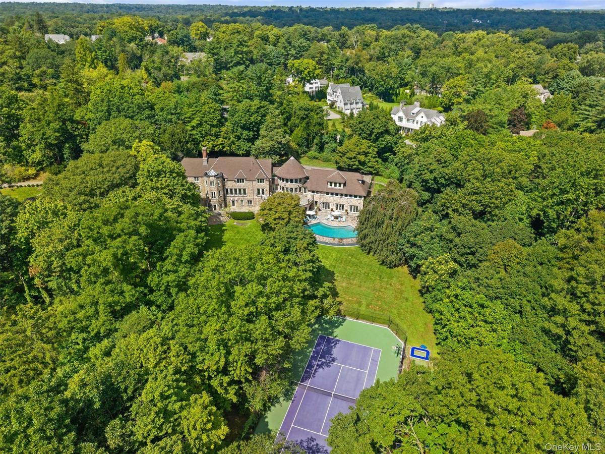 Set on 3 acres, this Sterling Ridge rennovated estate boasts a tennis court and pool