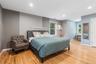 Wood-finish flooring, recessed lighting, and multiple windows