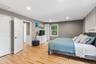 Hardwood flooring, recessed lighting, white interior doors, and a window with natural light