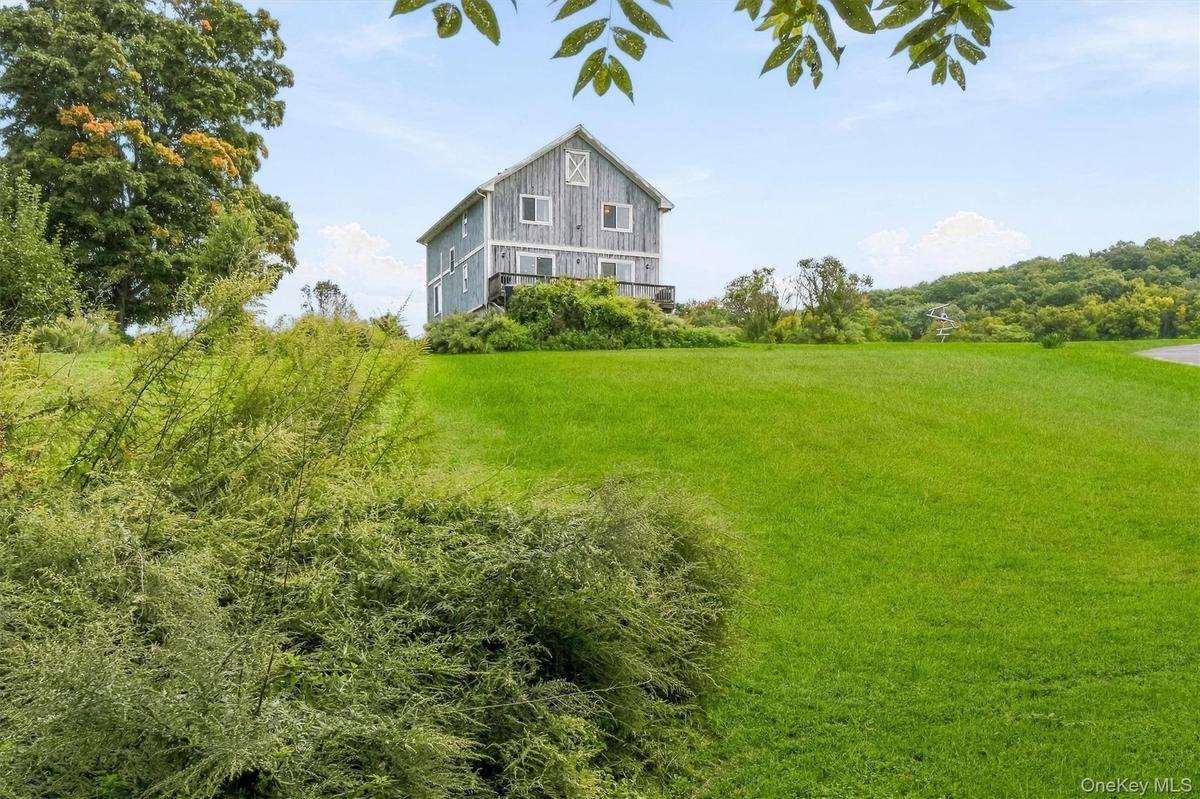 Barn-styled architecture, 3 Bedrooms, 2 full baths w/1250 septic (can be legal 4 bedroom).