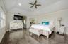 Primary BR En-Suite w/ Full Bath and 2 Closets. Crown molding.