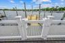 Deck w/ clear fence and new dock. Space for 2 boats