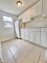 Versatile room with additional custom cabinetry and flexible space, providing plenty of options