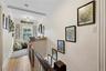 Upstairs, a sweet sunlit nook creates a natural spot for a desk, homework station, reading area, or quiet home office.