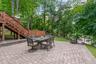 Stone Patio with stairs to Deck