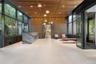 Community lobby with floor to ceiling windows and wooden ceiling