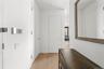 Hallway featuring light wood-style flooring