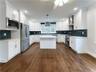 Oak floors throughout, modern kitchen with plenty of cabinetry!