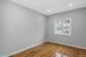 Empty room with wood finished floors and recessed lighting