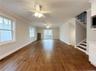 Open concept living space, living room with dining area in foreground.  Sliders to backyard.