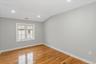 Unfurnished room with recessed lighting, light wood finished floors, and lofted ceiling