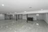 Basement with independent washer and dryer and recessed lighting