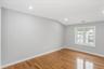 Spare room featuring light wood-type flooring, recessed lighting, and vaulted ceiling