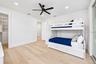Guest bedroom, with access to the balcony that has the spiral staircase to the pool deck