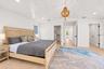 Primary suite with vaulted ceiling