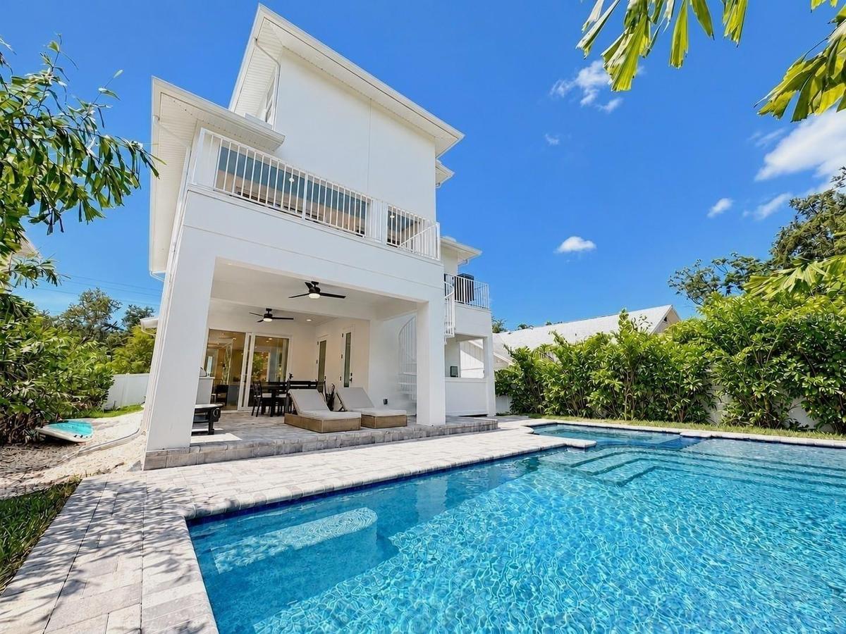 Heated saltwater pool, with a covered patio and outdoor kitchen