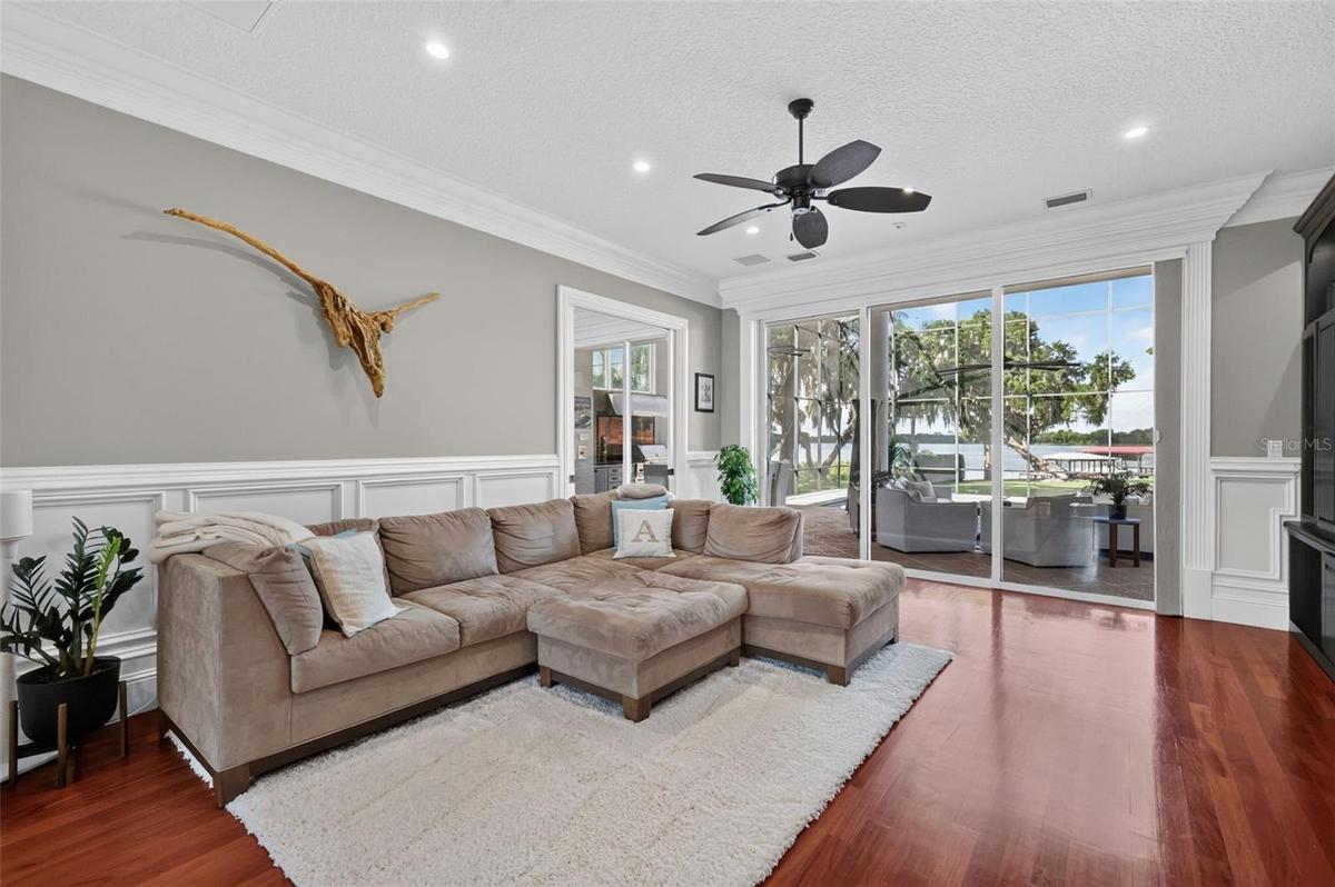 Living Room with with magnificent views of the pool and Lake Carlton