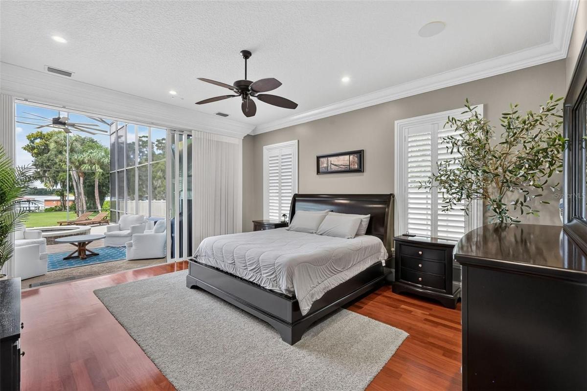 Primary Suite with views of the pool and Lake Carlton