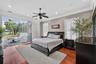 Primary Suite with views of the pool and Lake Carlton