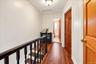 Upstairs hallway connecting bedrooms and full bath