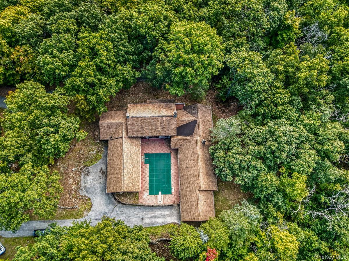 Left side is a three car attached garage.  The middle is the main residence.  On the right is the secondary residence with one car attached garage.