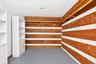 Primary bedroom walk-in closet