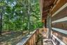 Balcony off game room.  Firepit and stone wall dots the landscape.