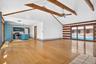 Second residence.  Family room to kitchen.  Wide plank hardwood floors.  Vaulted beamed ceiling.