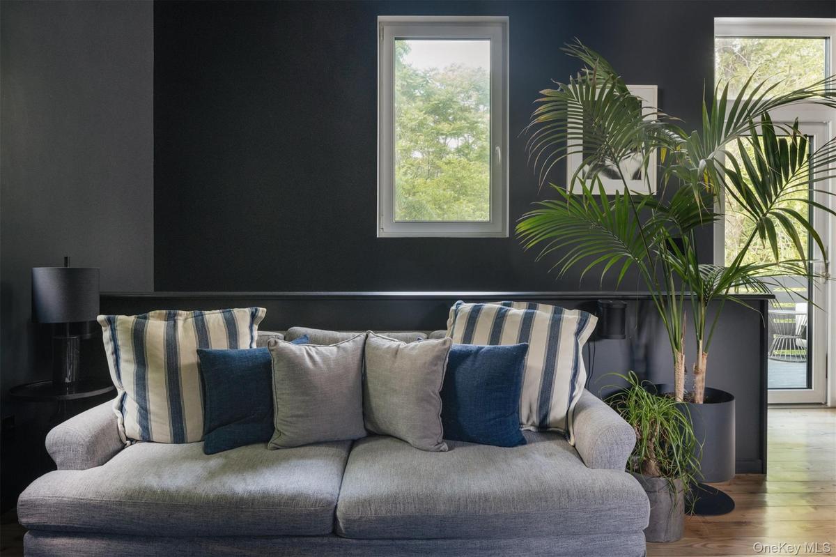Living room with healthy amount of natural light and wood finished floors
