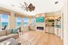 Living Area with Electric Fireplace & Built-In Shelving