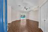 Step through the welcoming foyer and into the formal living and dining rooms with the double doors leading into a convenient office space or forth bed