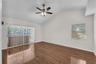 The spacious Primary Suite is tucked away on one side of the home and features two walk-in closets, Vaulted ceilings, private access to the screened l