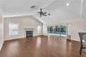 A triple sliding glass door in the family room opens directly to the pool lanai, creating a seamless connection between indoor and outdoor living.