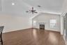 The inviting family room centers around a fireplace, creating a warm and comfortable gathering space.