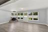 Enjoy tons of natural light and views into your private backyard along with a working fireplace.
