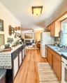 Upper Apartment  Galley Kitchen with wood flooring