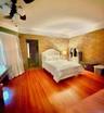 Main House Upstairs Bedroom Hardwood flooring, painted walls with decorative border, white trim