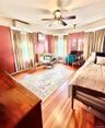 Main House Upstairs Bedroom  Hardwood flooring, painted walls with decorative border, white trim