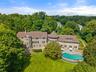Welcome to Four Winds an incredible renovated estate set on 3 acres