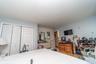 Room featuring light-colored walls and a flat ceiling