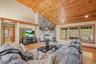 Vaulted ceiling with stone faced fireplace