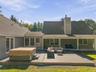 back yard deck with hot tub and lounge area