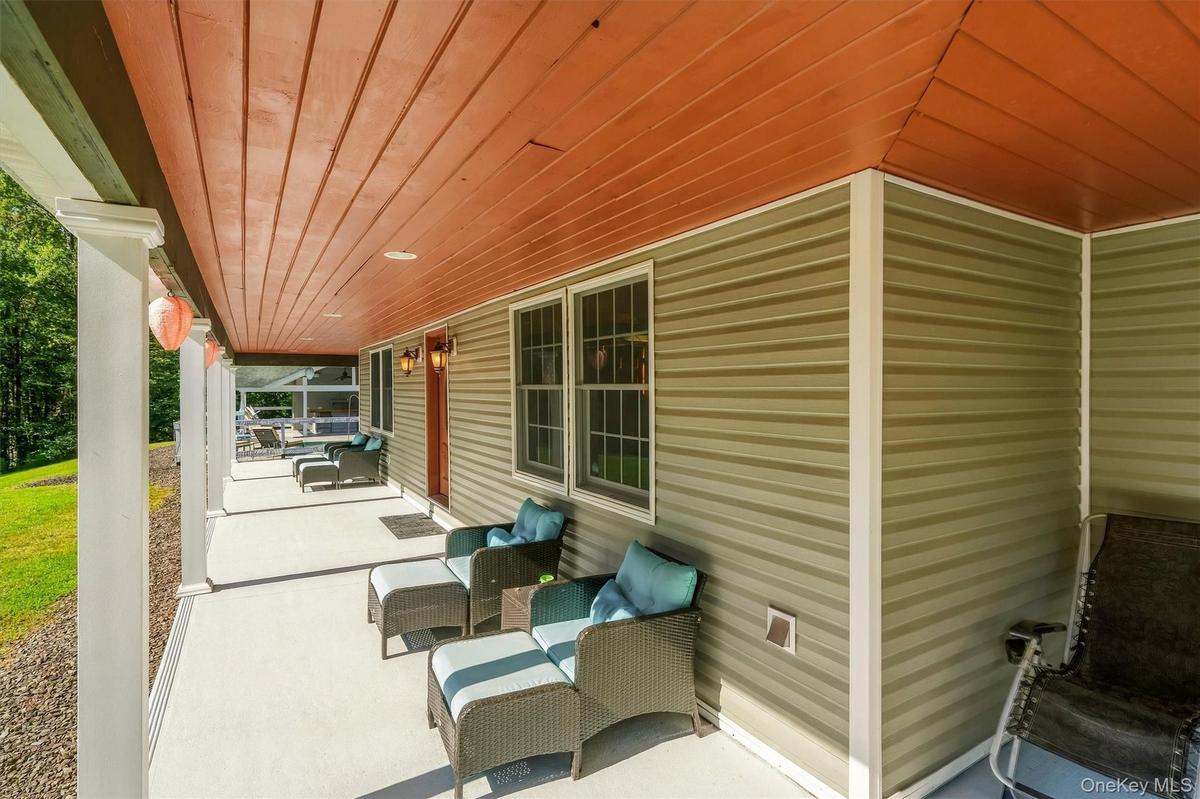 Front porch to pool which wraps around house
