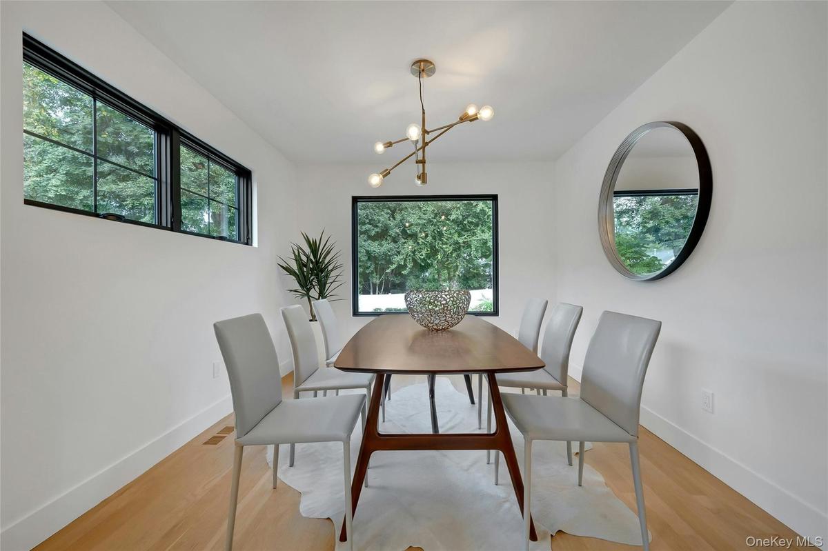 In the dining room, I   love this oversized picture window overlooking the backyard- it brings the outdoors right in.