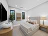 Bedroom with neutral tones and wood furniture