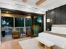 Primary suite opening to the private balcony