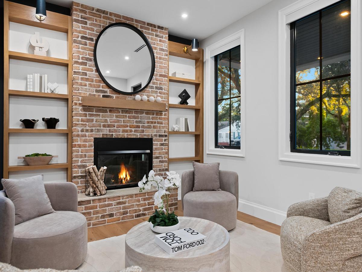 Living room with fireplace and built-in shelving