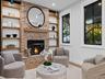 Living room with fireplace and built-in shelving
