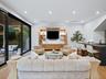 Living room with built-in media wall and fireplace
