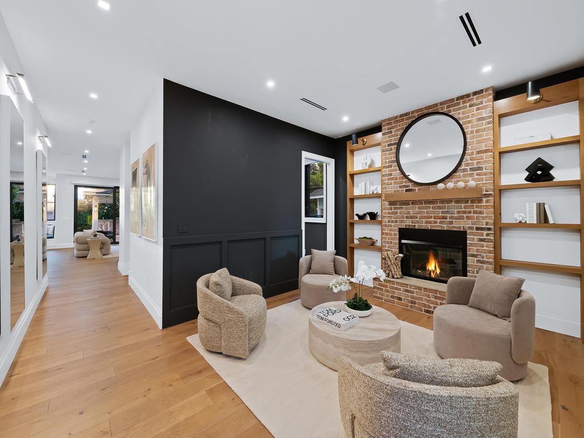 Great room with fireplace open to the entry